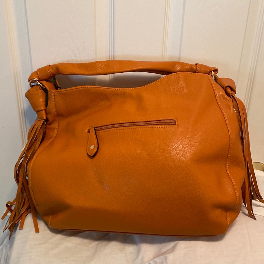 Unknown name large size rust color purse